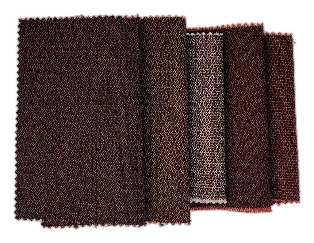 Nærbilde av teksturdetalj i Tiny Pebbles, ullbasert togtekstil designet av Ragnhild Nordhagen for GU Uldvarefabrik