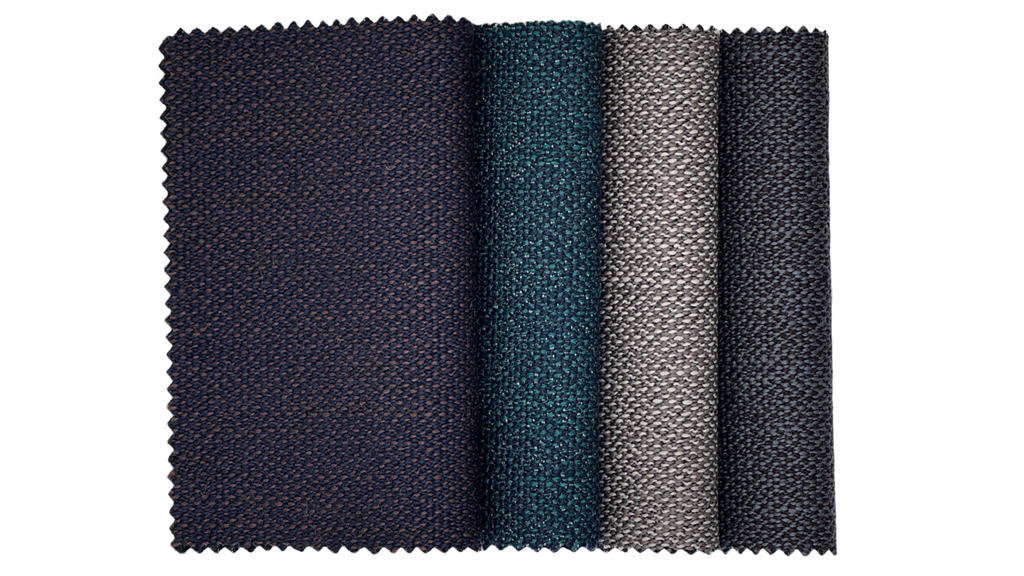 Nærbilde av teksturdetalj i Dypdal, ullbasert togtekstil designet av Ragnhild Nordhagen for GU Uldvarefabrik